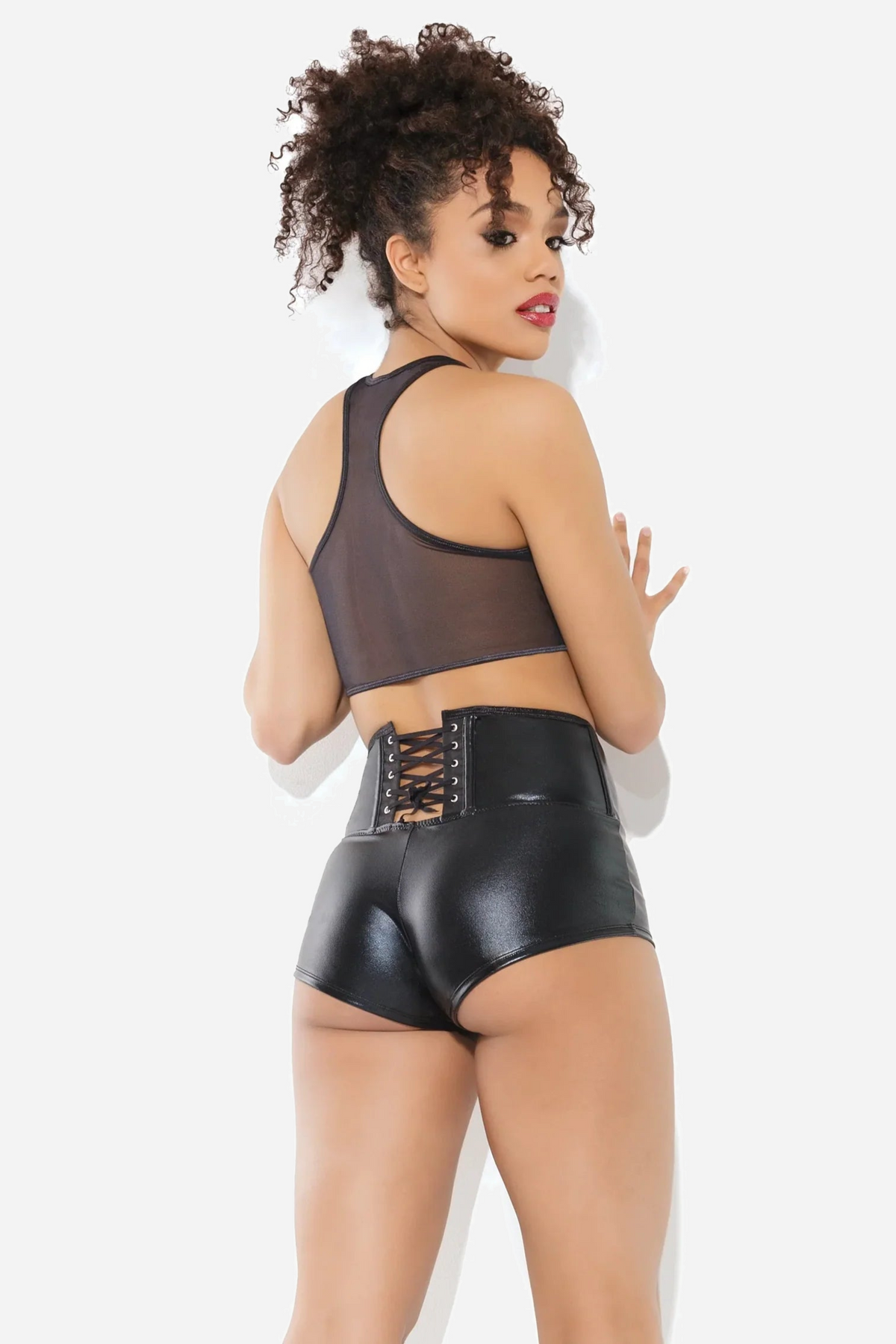 Back view of the black wet-look booty shorts showing the corset lacing and buckled waistband