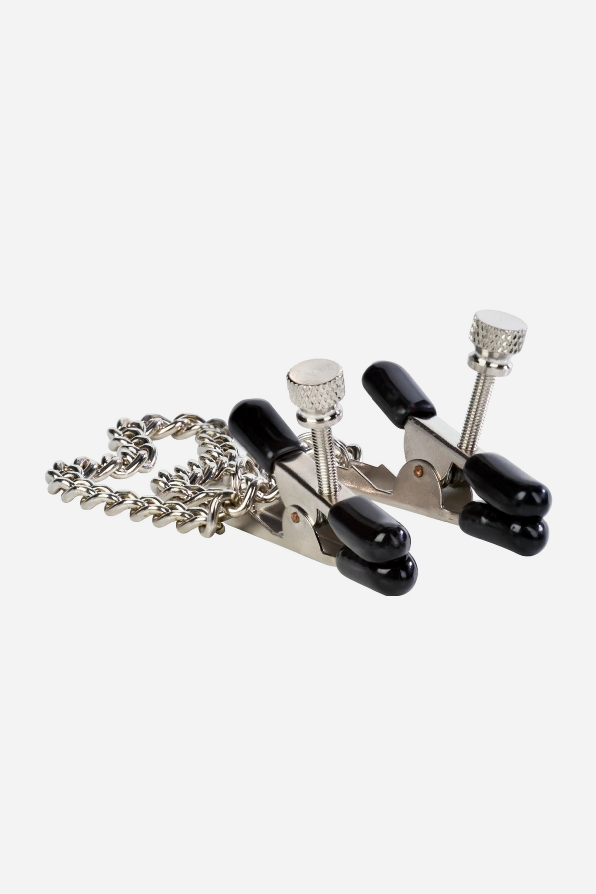Close-up on grey of the Let's Play bull nose nipple clamps, chrome jaws with black rubber tips and knurled adjustment screws, the chain coiled behind.
