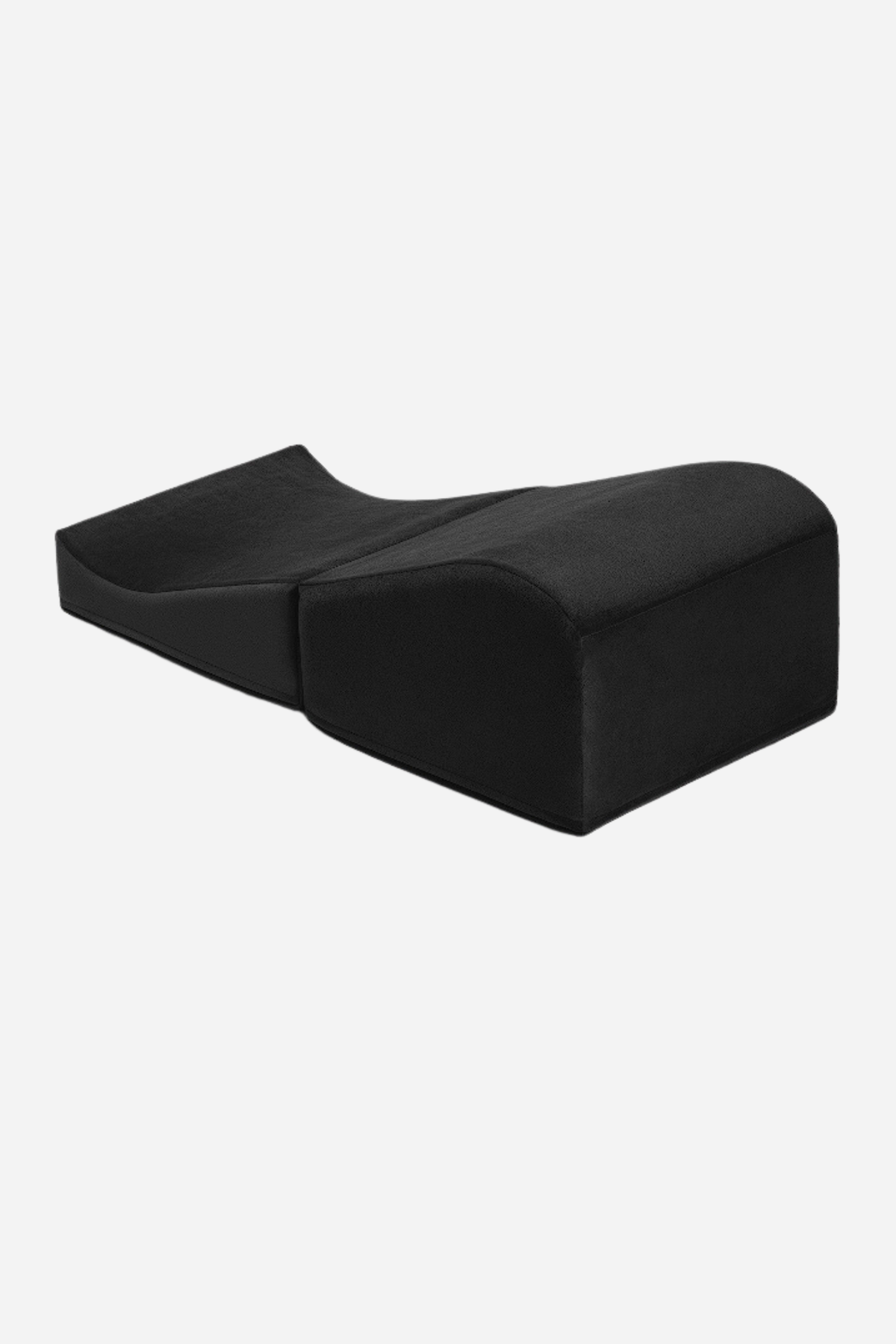 Black Liberator Flip Ramp, a two piece microvelvet foam ramp and wedge positioning pillow set laid out side by side, on grey