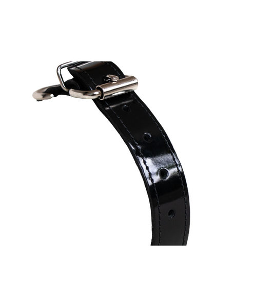 close up of the belt-style buckle and shiny black patent leather on the bdsm collar