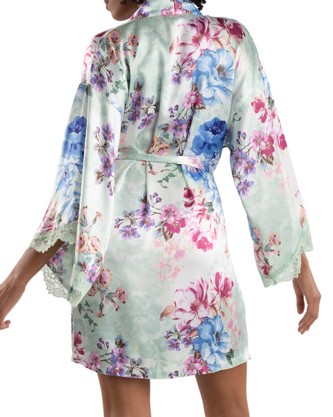 model shows the back of the robe with more details of the different colors in the floral print