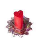 red heart shaped wax play pillar candle on lotus dish