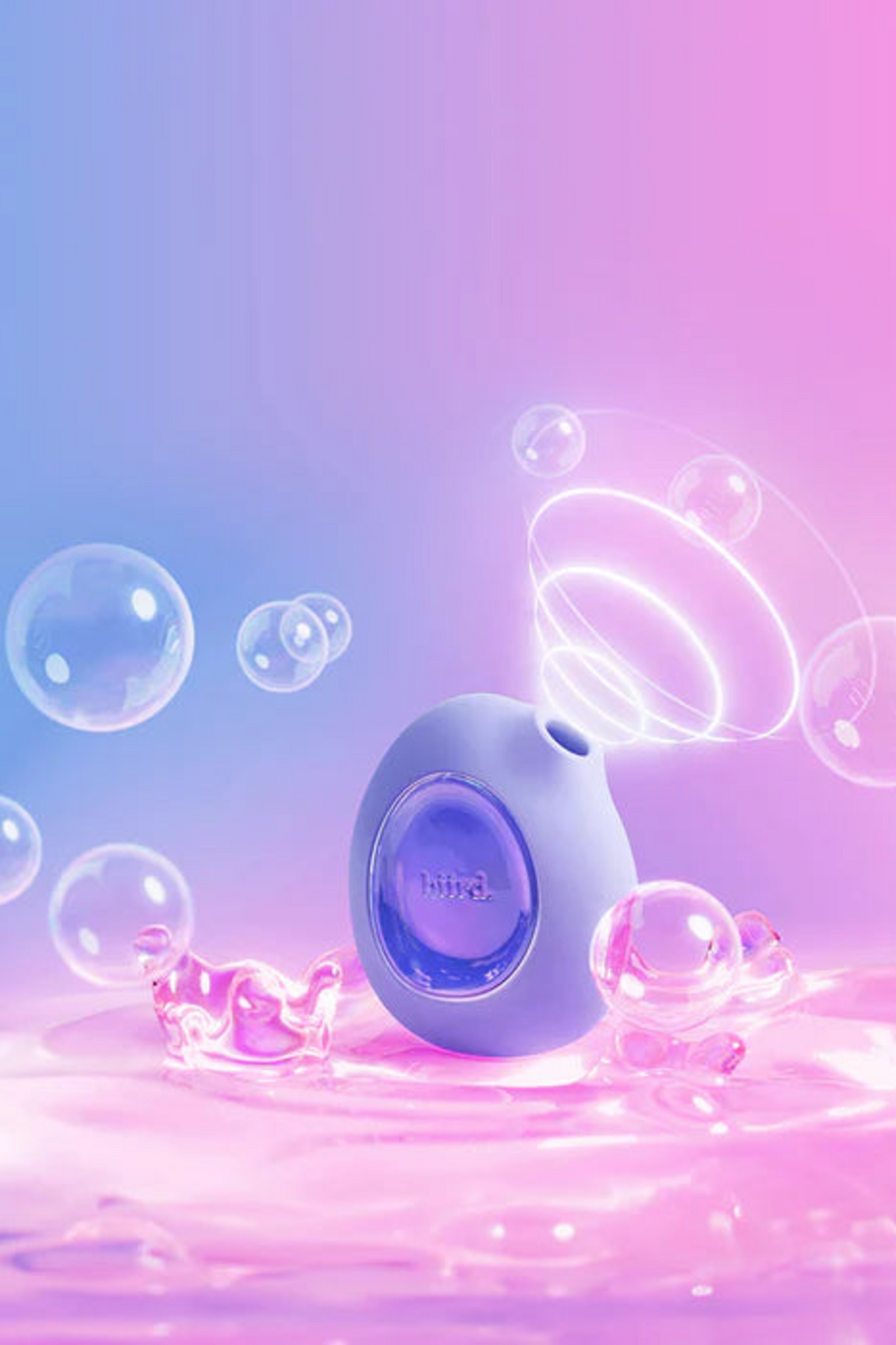 Lilac Lumii sitting in shimmering pink water surrounded by bubbles and air pulse rings, highlighting that the toy is fully waterproof
