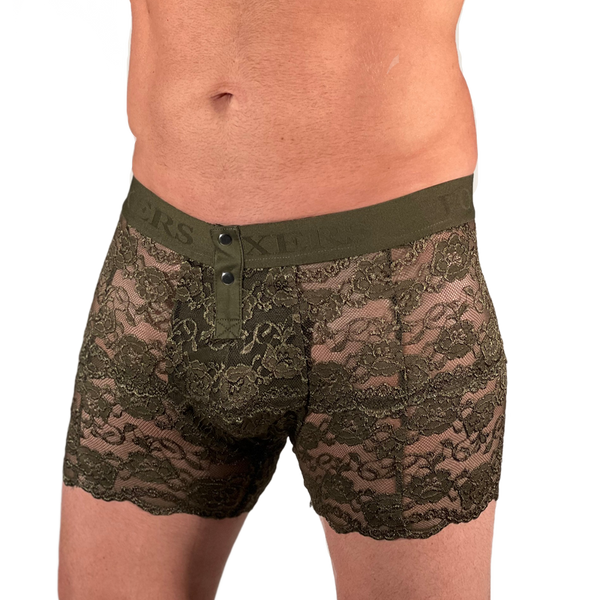 size small white model zoomed in on the torso/pelvis area. model is wearing olive green lace men's lingerie