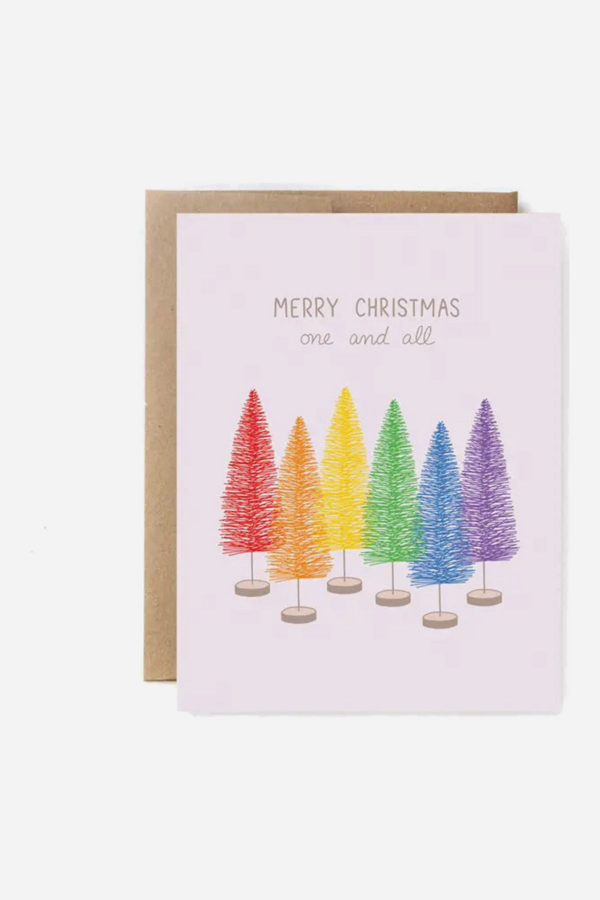 Pale pink greeting card reading Merry Christmas One and All above six bottle-brush trees in rainbow colors, shown with a kraft paper envelope