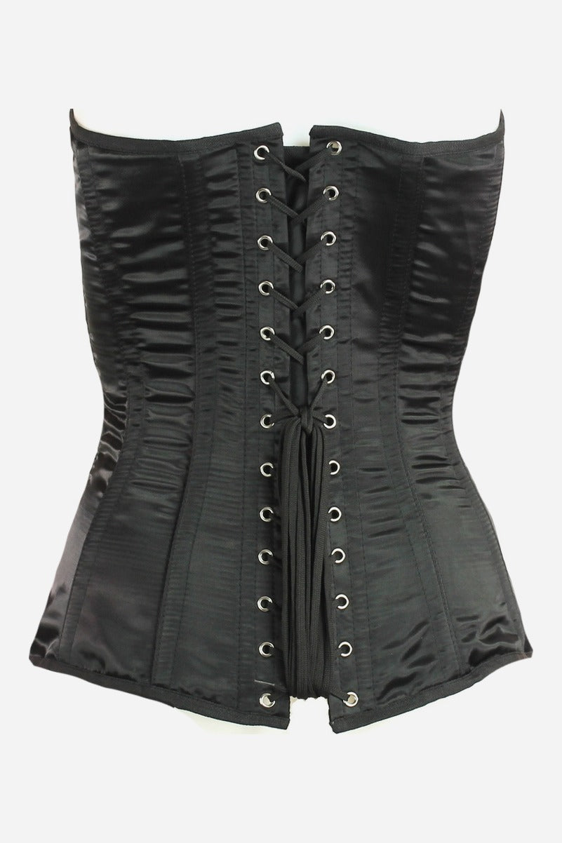 Back of the black satin Midnight overbust corset showing black laces crossed through two rows of silver grommets running the full length