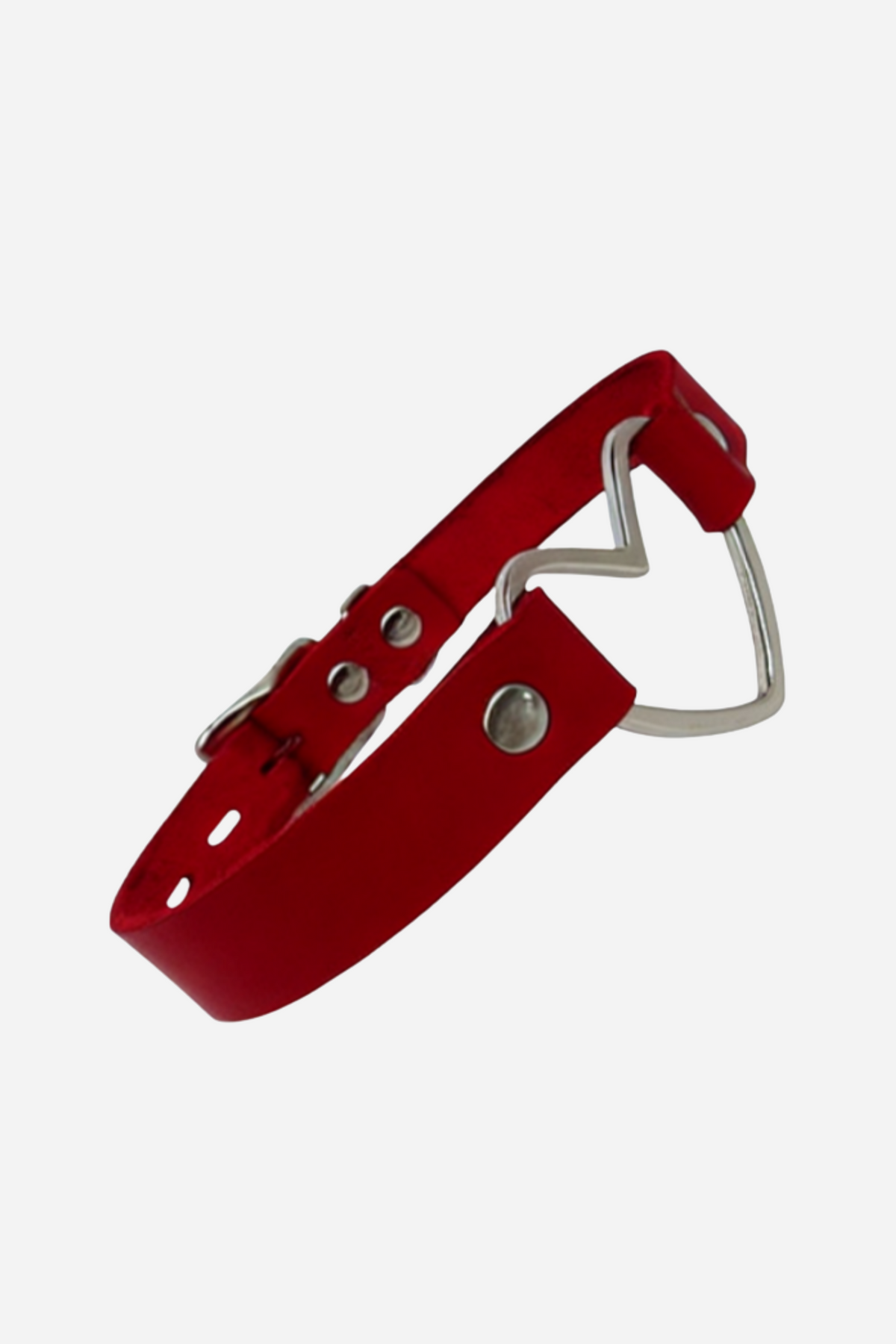 A burgundy leather collar curled into a loop, with a silver heart-shaped ring at the front, round studs and a buckle, on a plain grey backdrop.