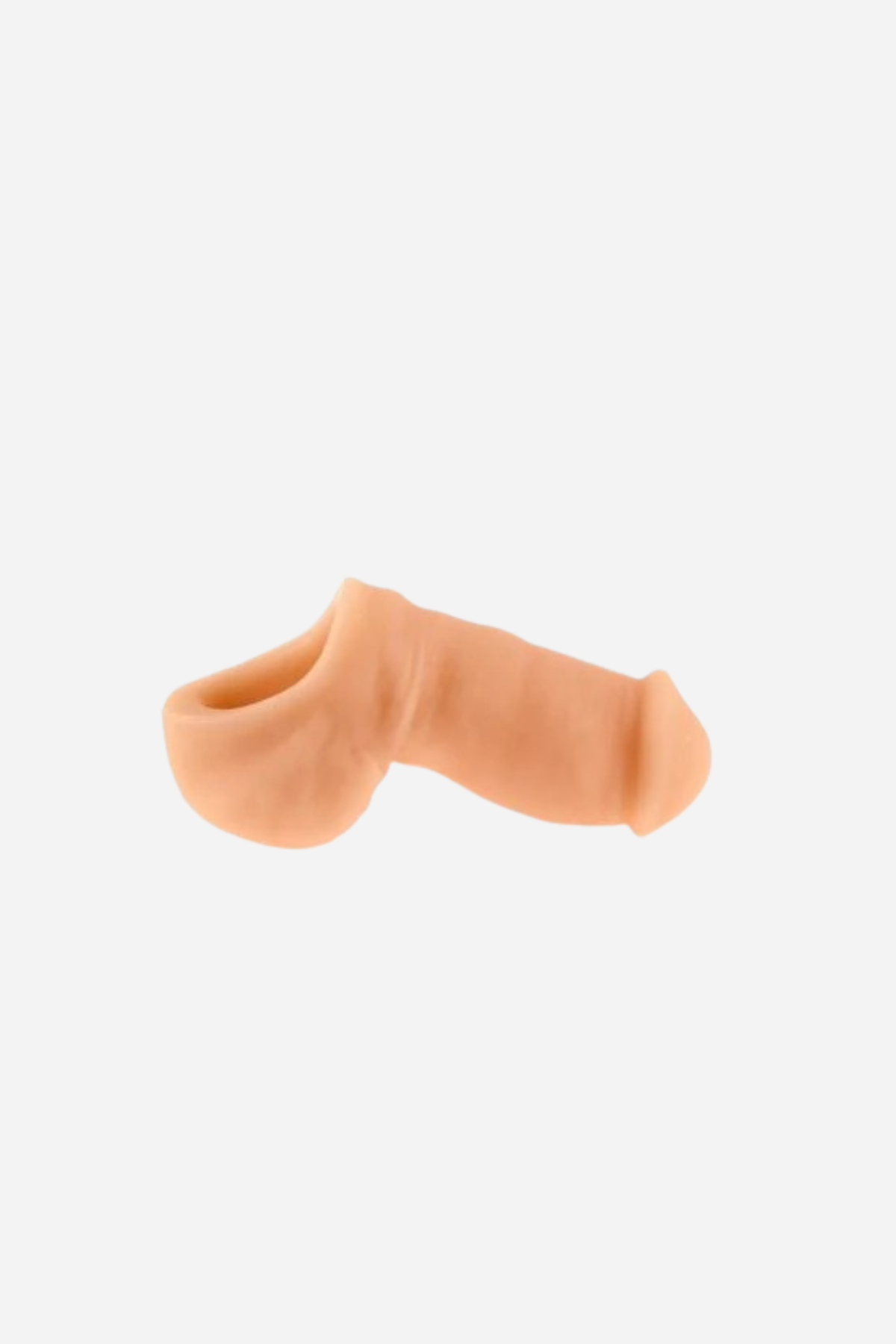 NYTC Sam stand-to-pee packer in Cashew, a lighter skin tone version of the silicone STP device, side view on a light grey background