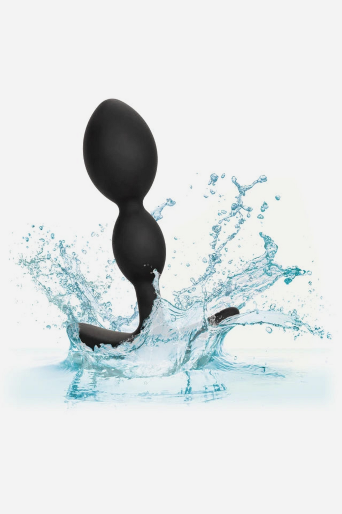 Black No Bounds Dual Drop plug splashing into water, showing that the silicone plug is waterproof and easy to clean, on grey
