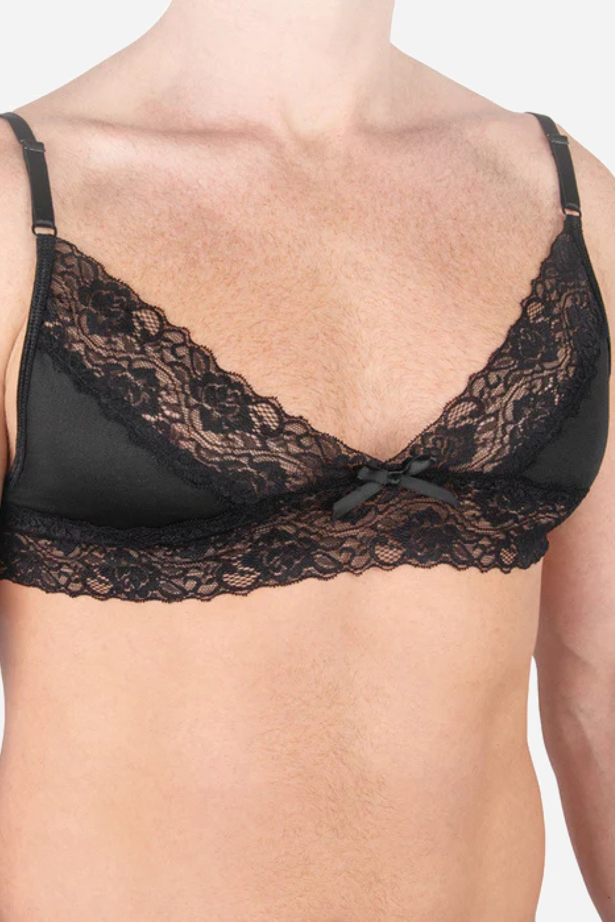 Black satin and lace small-cup bra with scalloped lace trim and a small bow at the centre, worn by a model