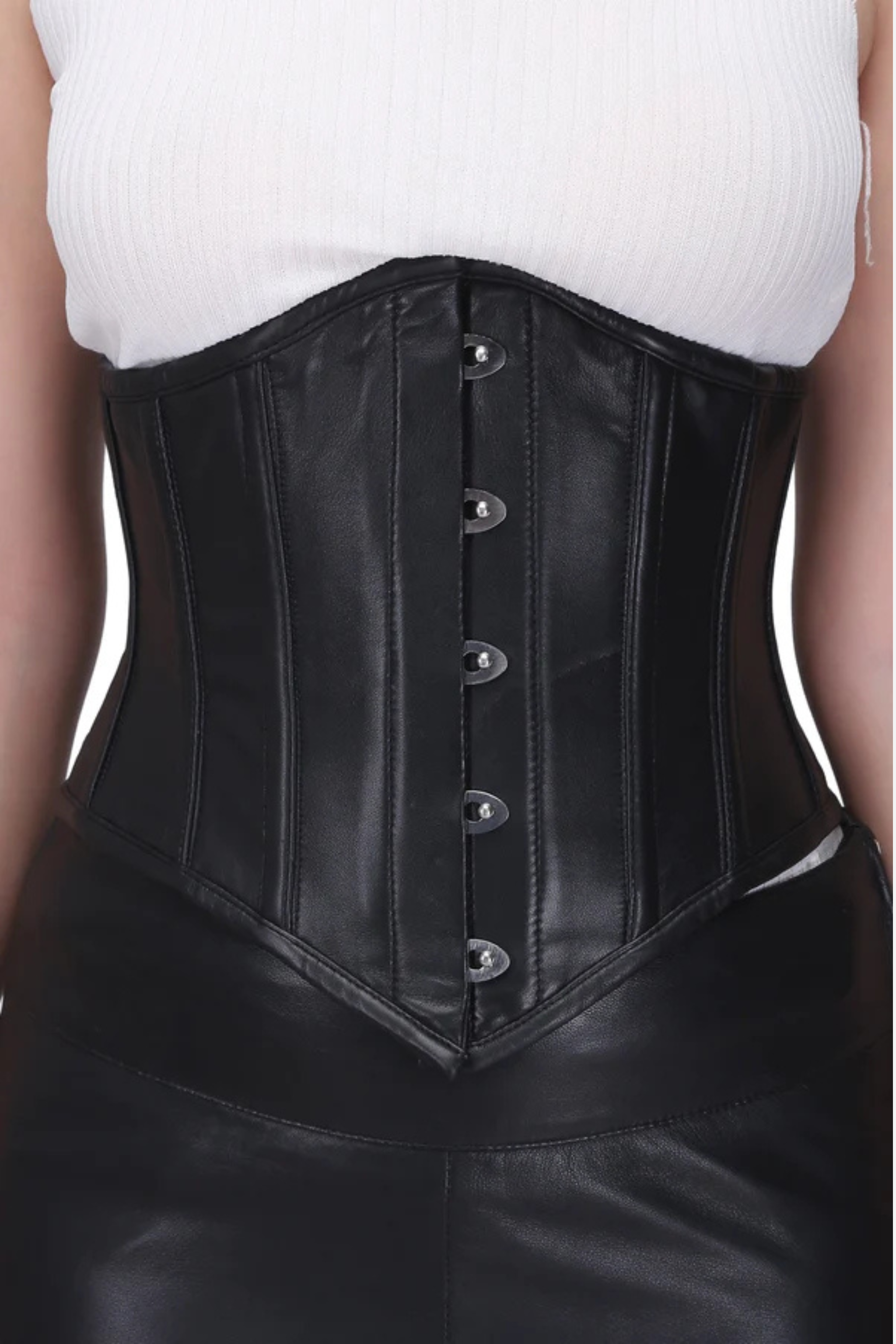 Black leather corset worn by a person on a white background