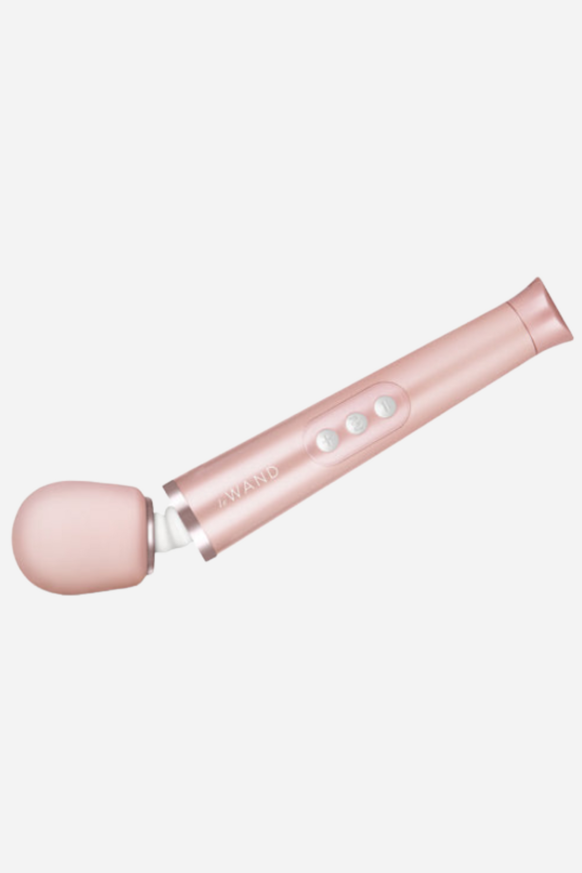 Rose gold Le Wand Petite lying on its side, showing the control buttons along the handle and the soft pink silicone massage head