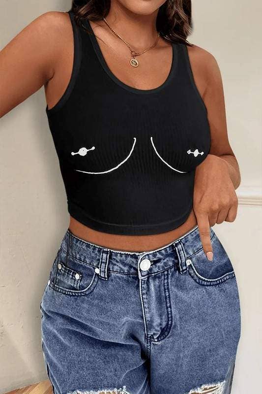 Model in a black ribbed sleeveless crop tank printed with a white sketch of pierced breasts, worn with ripped light wash jeans