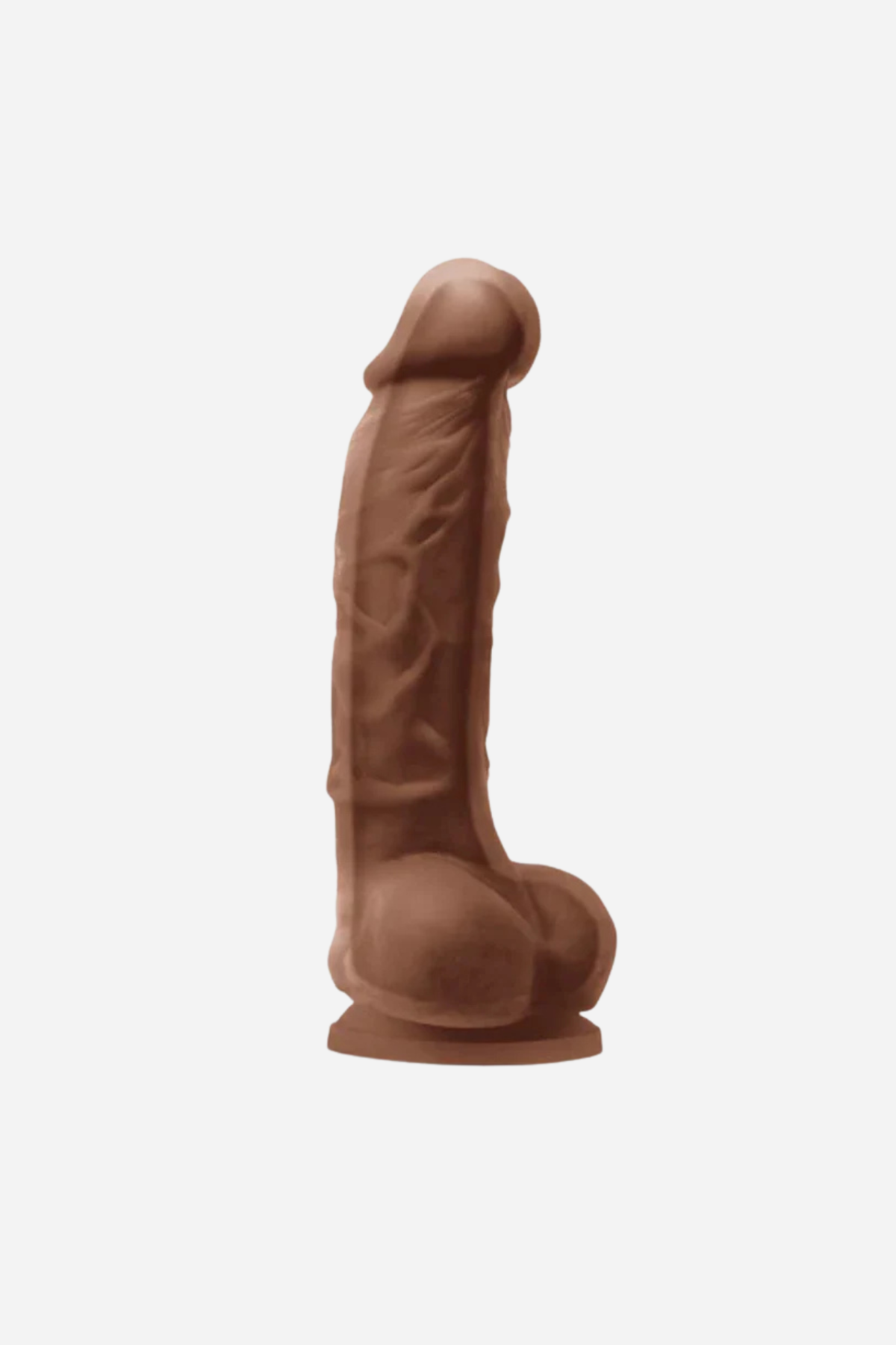 Pleasures 5 inch realistic dual density dildo in Caramel, side view showing the veined shaft, balls and suction cup base on light grey