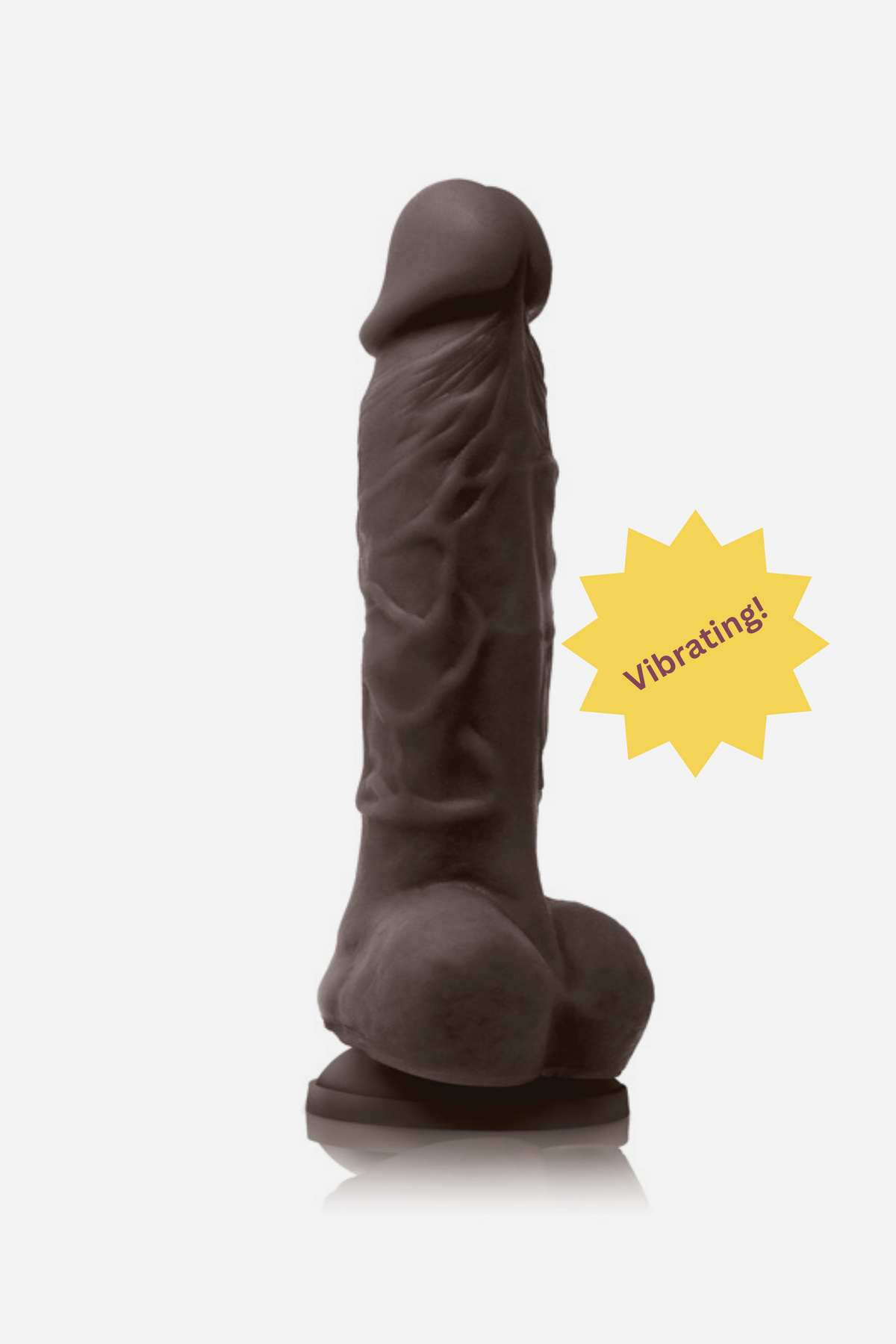 Pleasures 5 inch realistic vibrating dildo in chocolate skin tone with lifelike veins, suction cup base and multi-speed vibration, shown on a grey background