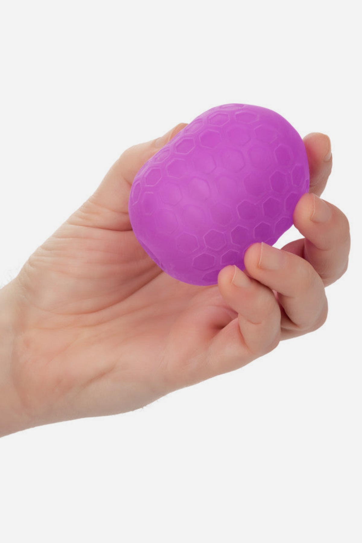 Hand holding the purple Pop Sock Textured Stroker to show its compact, palm-sized shape and soft, stretchy textured silicone body
