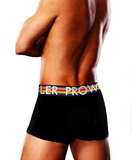 shirtless white male model turns away from camera to show off the black trunk briefs with the progress pride flag waistband