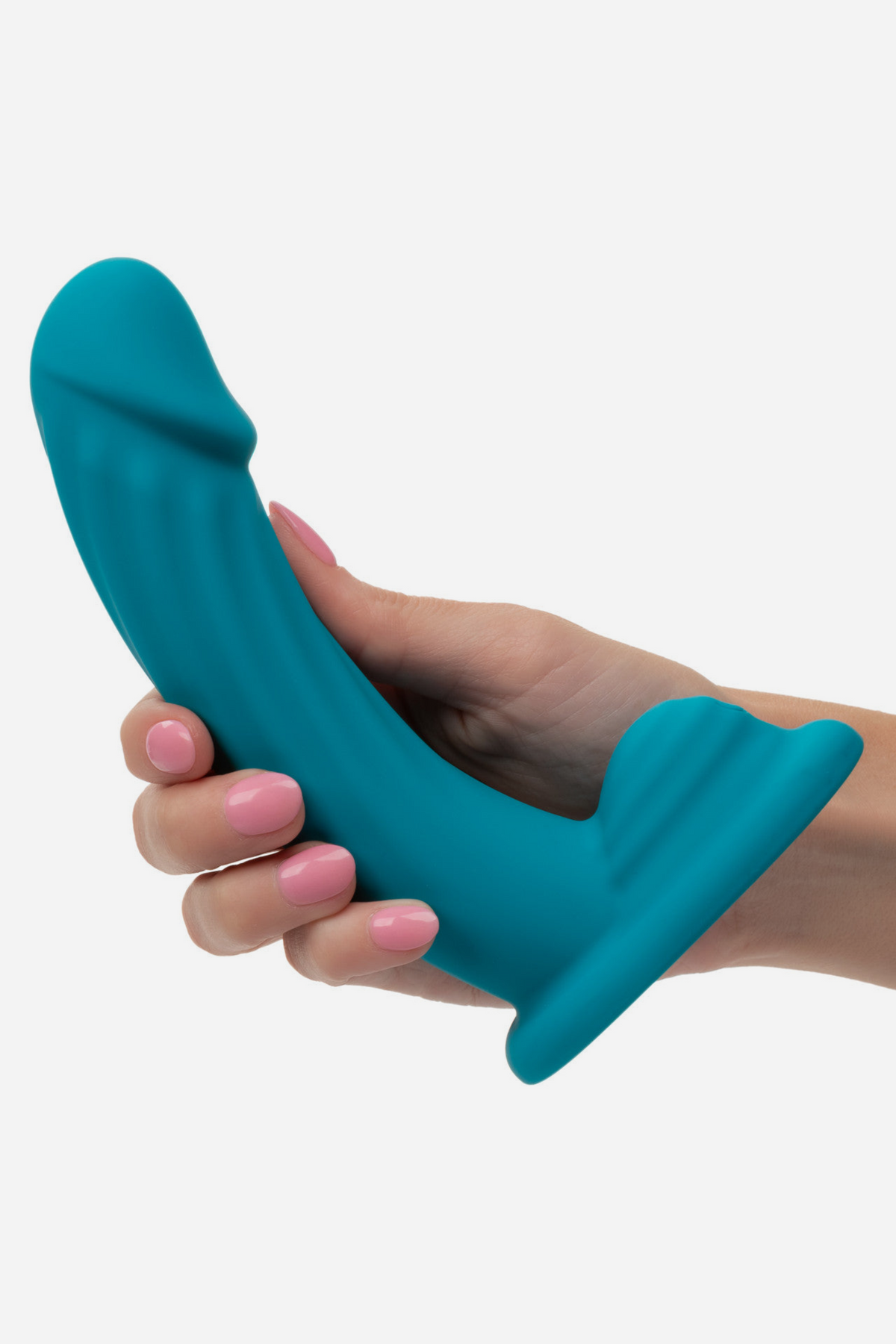 Ride Me vibrating dildo in Teal held in a hand to show its size, with the curved shaft and external clit hump on a light grey background