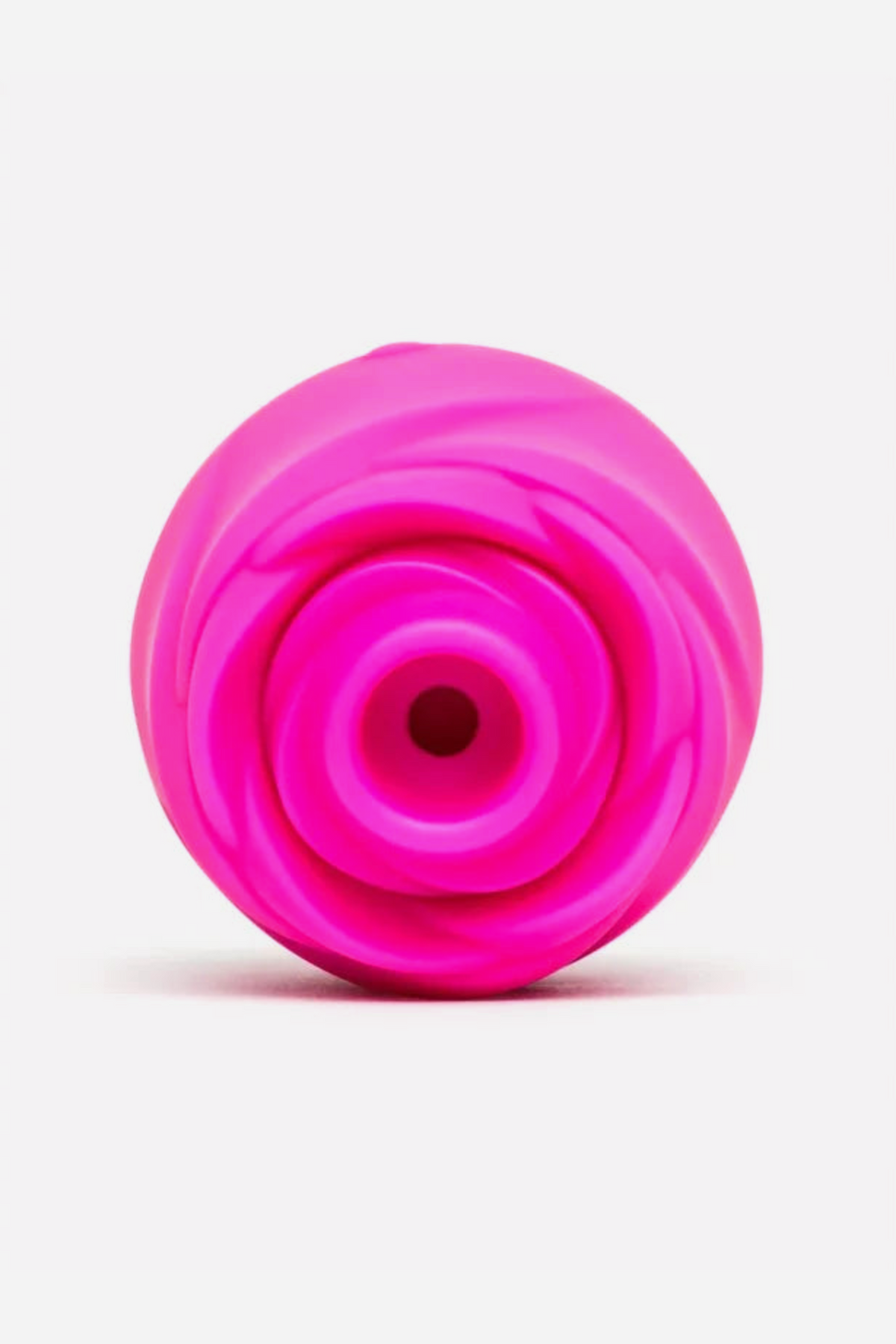 Close-up of the hot pink Romp Rose 2.0 showing the soft silicone opening at the centre of the petals that delivers air pulsation