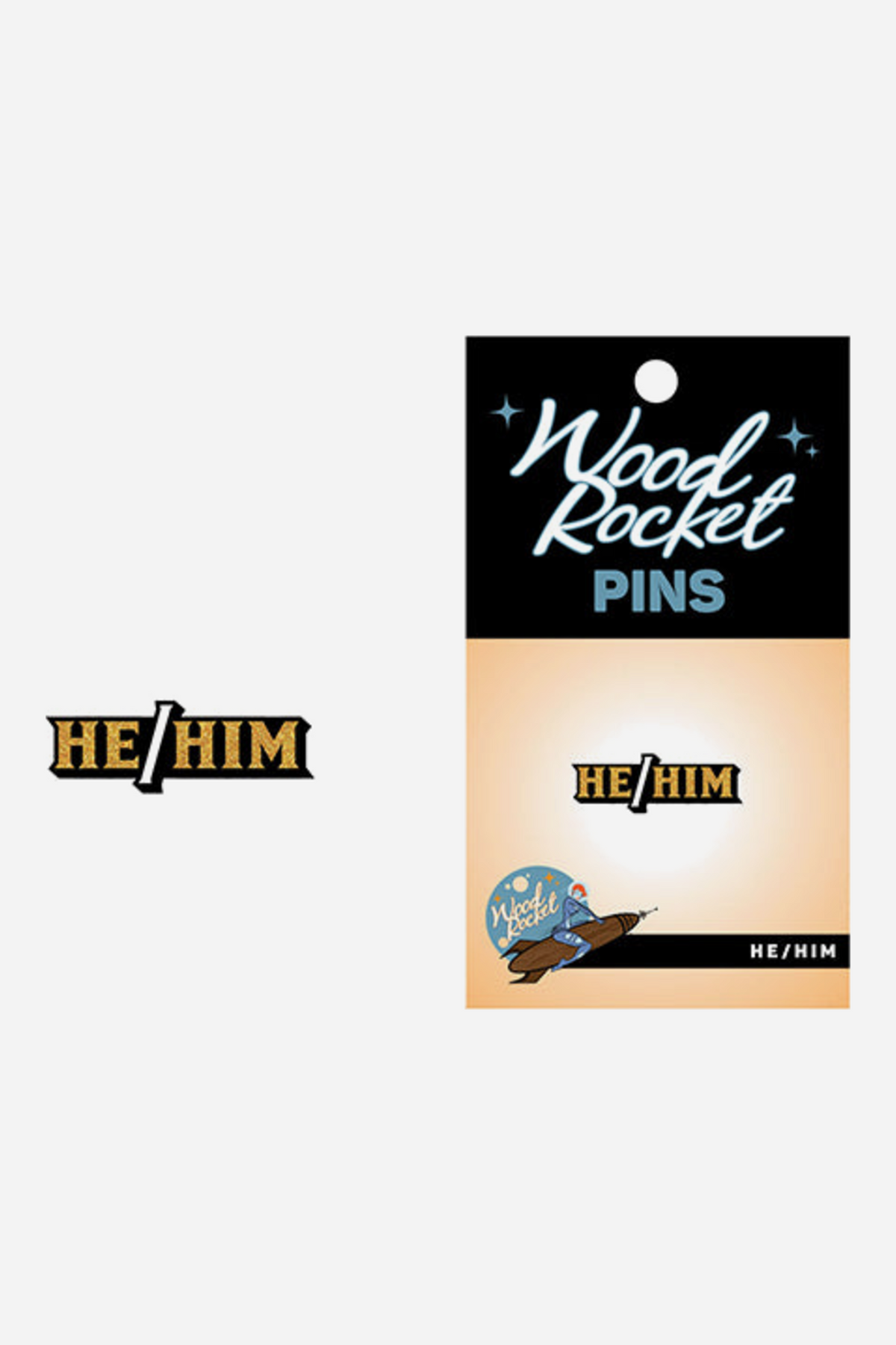 Gold and black enamel pin reading HE/HIM, shown beside its Wood Rocket Pins backing card with a black header, peach gradient and a small rocket logo.