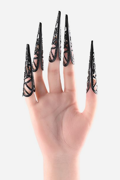 Hand wearing five She's A Brat black metal sensation finger tips, each a pointed 3.25 inch filigree claw that slips over the fingertip