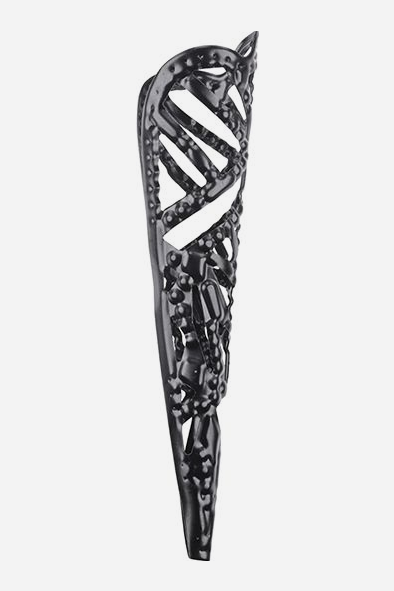 Close-up of one She's A Brat black sensation finger tip, showing the open filigree pattern, adjustable open back and rounded pointed tip