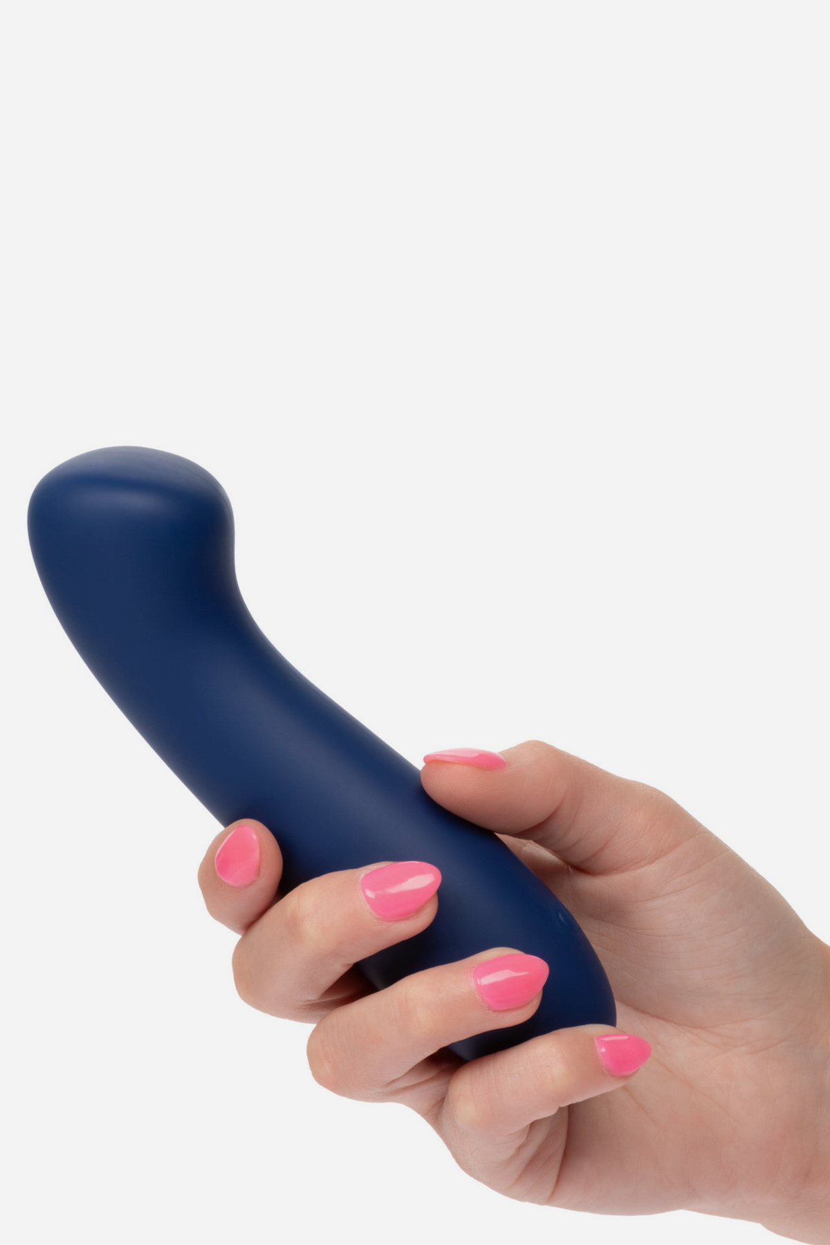 Hand holding the Soft As Satin G-spot vibrator in navy blue, showing its size, smooth silicone body and angled tip on light grey