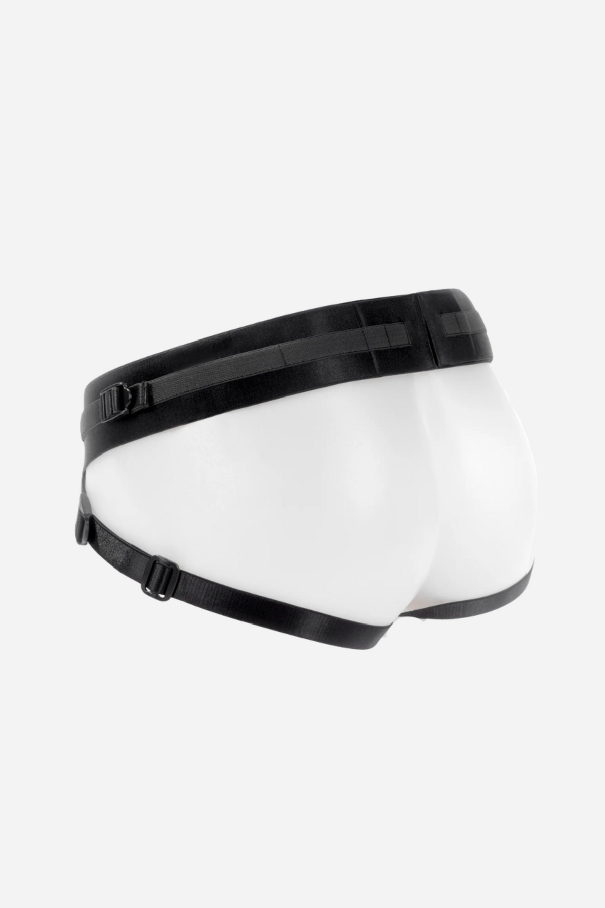 Back view of the SpareParts Joque Harness on a clear form, showing the wide waistband and two adjustable leg straps of the jock-style harness