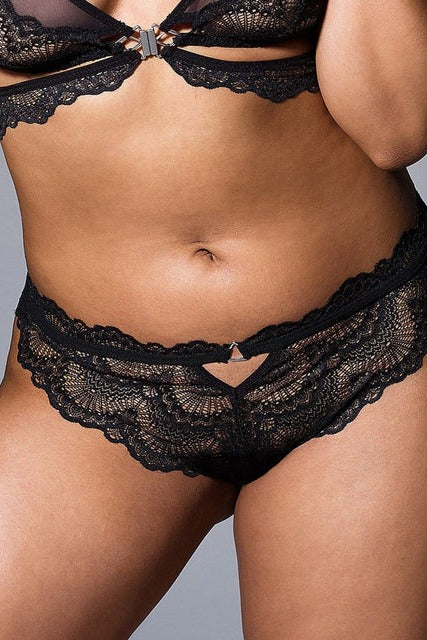 Front view of a model in the Sugar and Kane black lace crotchless bikini with a keyhole cutout at the waist, worn with a black lace bra