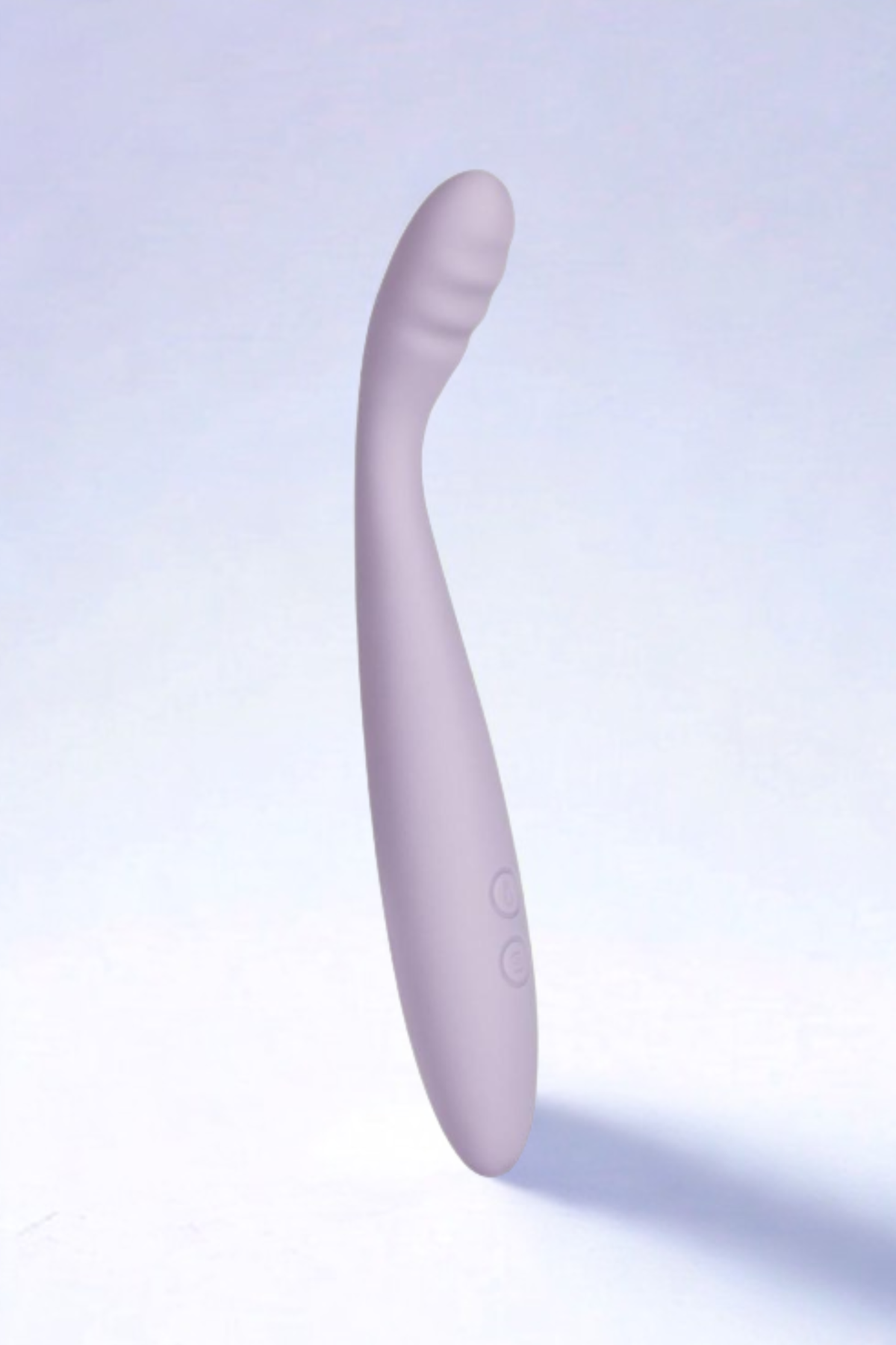 The lavender CiCi 2 standing upright against a pale lilac backdrop, its slender curved body casting a soft shadow to one side.