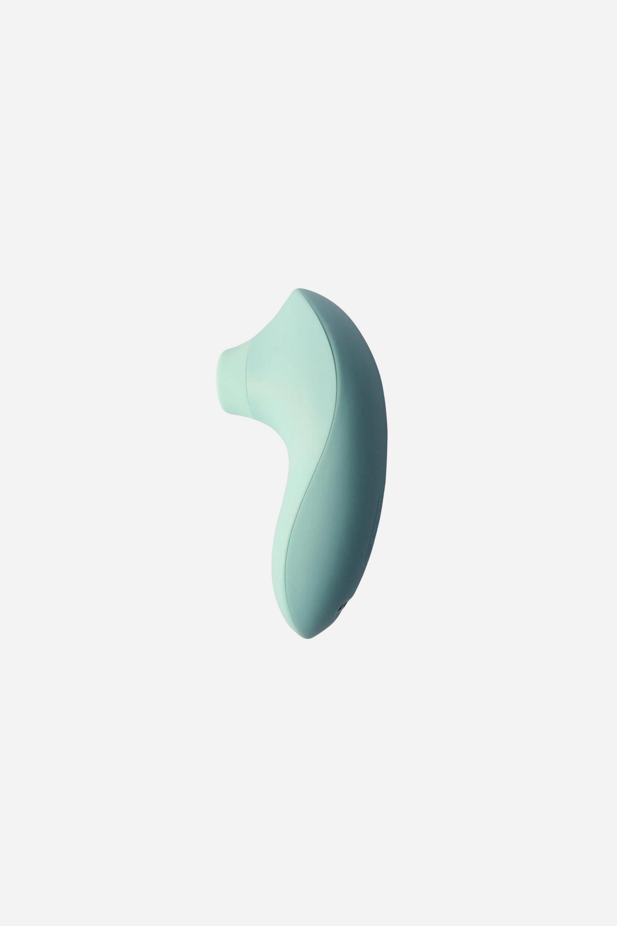 The Svakom Pulse Lite Neo in pale mint green, a small curved silicone body with a rounded suction opening set into its narrow tip.