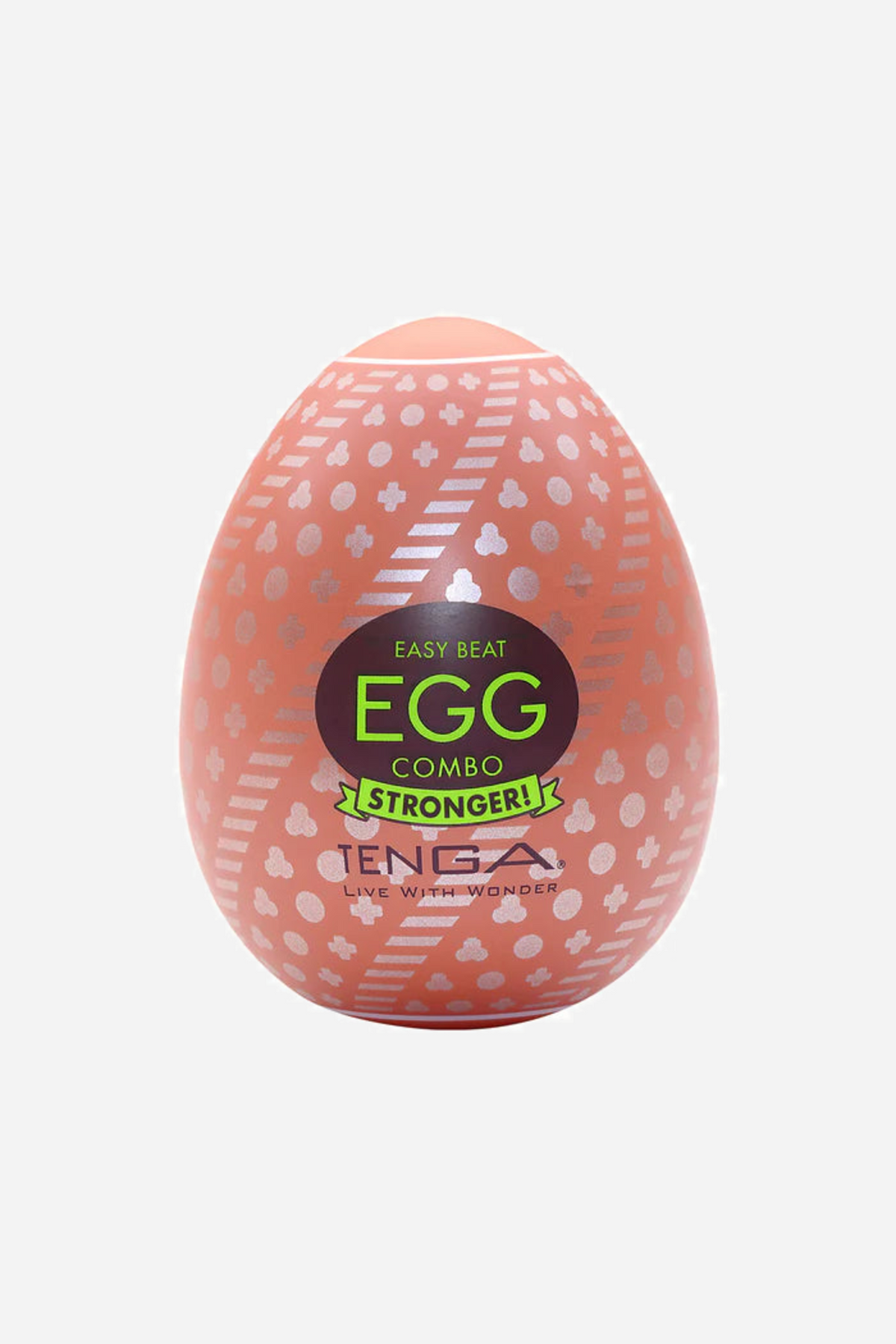 A coral pink Tenga Egg stroker with a shell of raised bobbles and a green and black EGG label, standing upright on a plain background