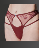 close up of small white model wearing the The Sorceress Embroidered Thong in Oxblood