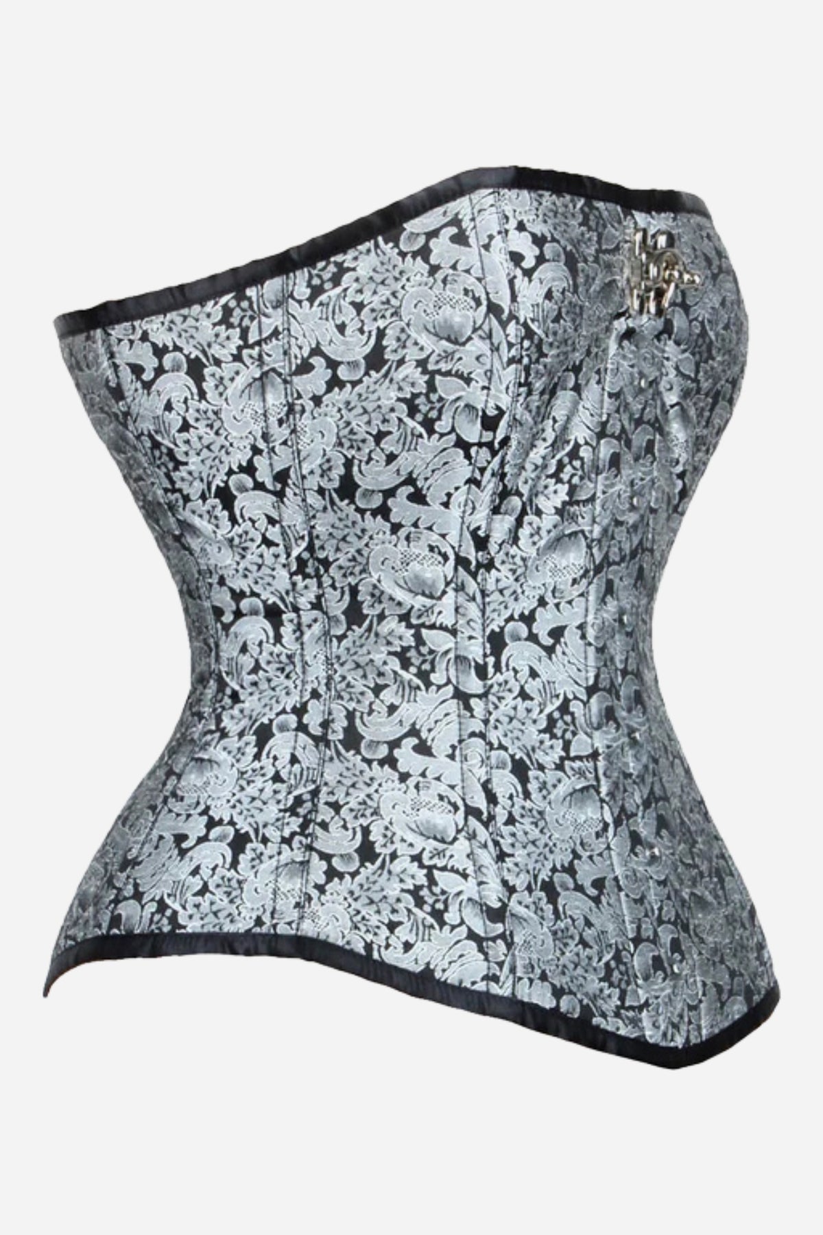 Side view of the Timeless longline overbust corset in black and silver floral brocade with black satin trim and a shallow straight bustline