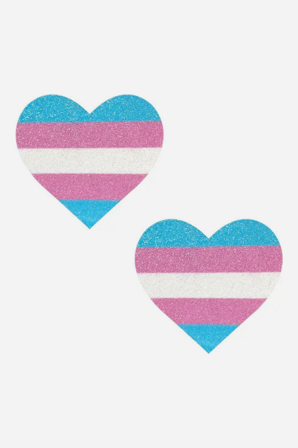 Two heart-shaped nipple pasties covered in glitter, striped light blue, pink and white like the transgender pride flag, shown on a light grey background.