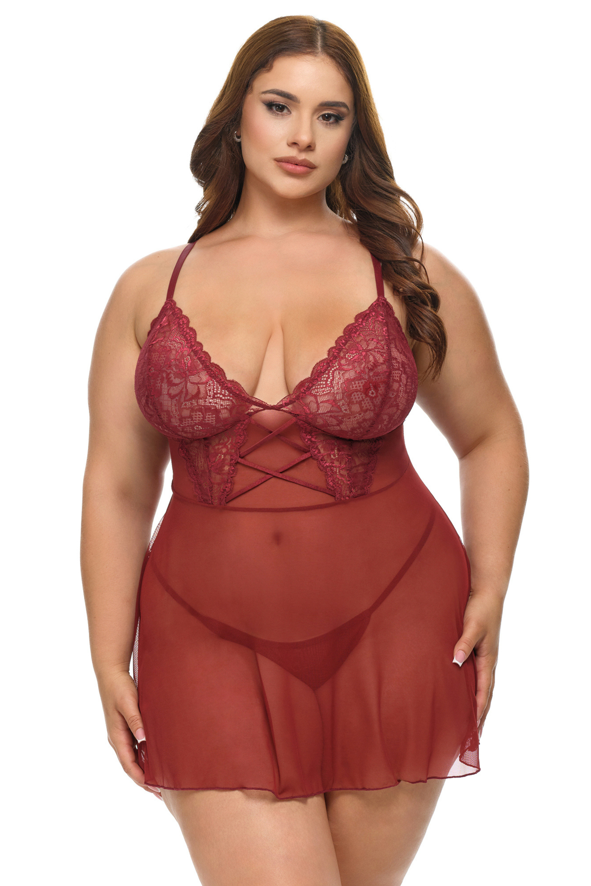 Woman wearing a red lace lingerie set on a white background