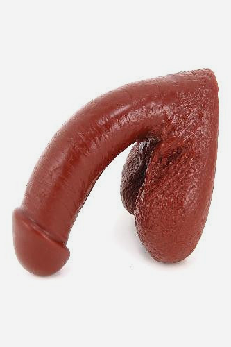 Vixskin Mr. Right silicone packer in Chocolate, a realistic soft packing penis with textured testicles shown from the side on light grey