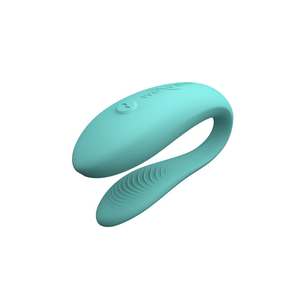c-shaped hands-free wearable vibrator in aqua with textured internal arm
