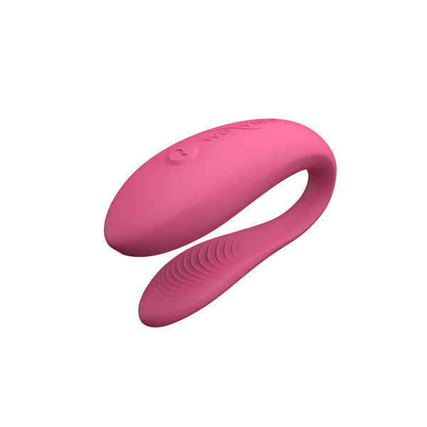c-shaped hands-free wearable vibrator in pink with textured internal arm