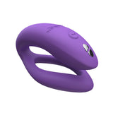 c-shaped hands-free wearable vibrator in lilac with wider, o-shaped internal arm