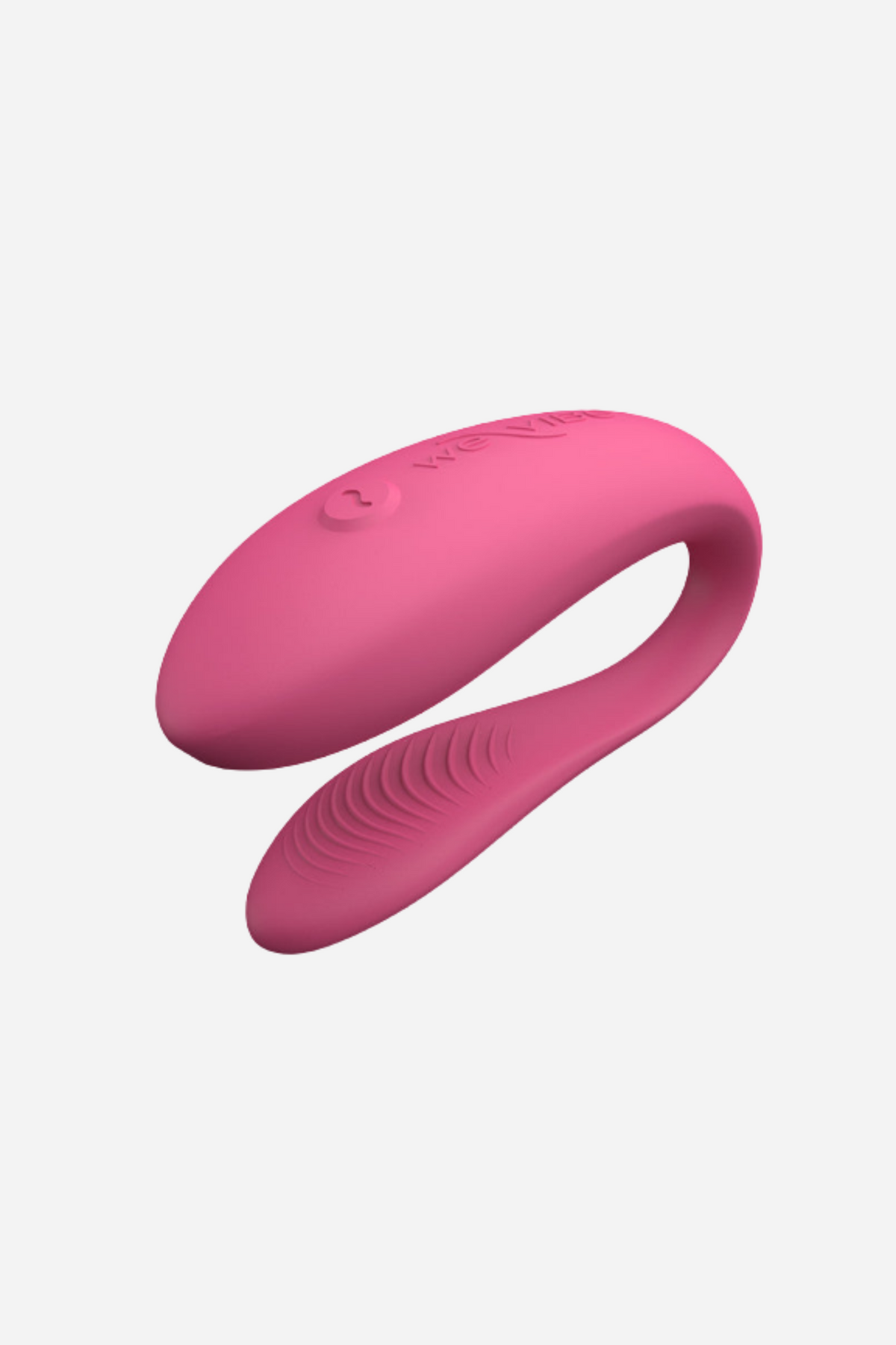 We-Vibe Sync Lite couples vibrator in Pink, showing the C-shaped design with textured inner arm and flexible bridge on grey
