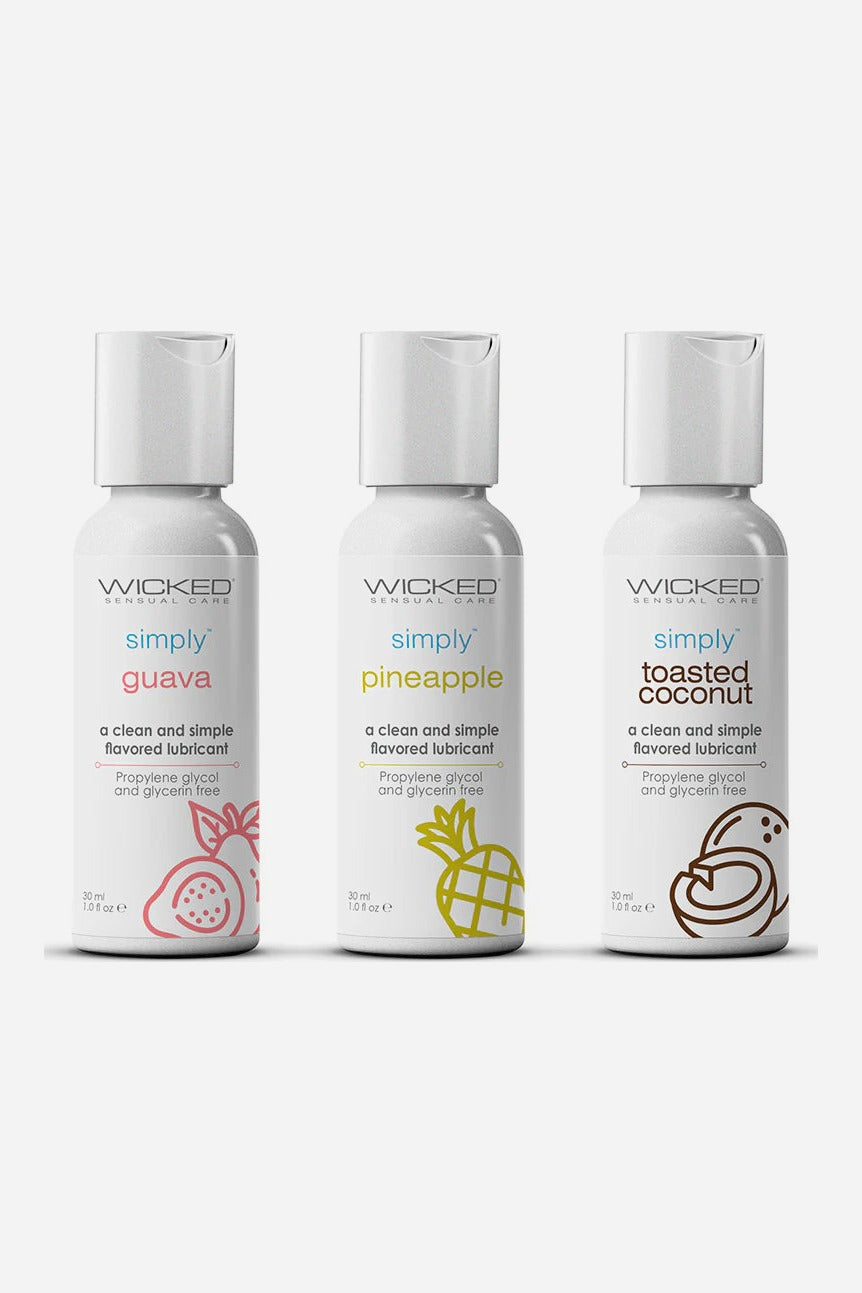 Front of three white Wicked Simply 1 oz lube bottles labelled guava, pineapple and toasted coconut, each with a line drawing of its fruit