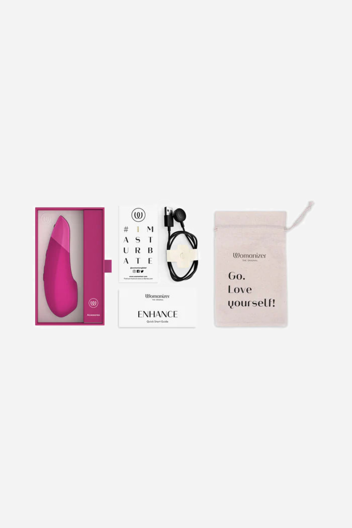 The pink Womanizer Enhance shown with its retail box, an instruction leaflet and a soft pink storage pouch laid out side by side