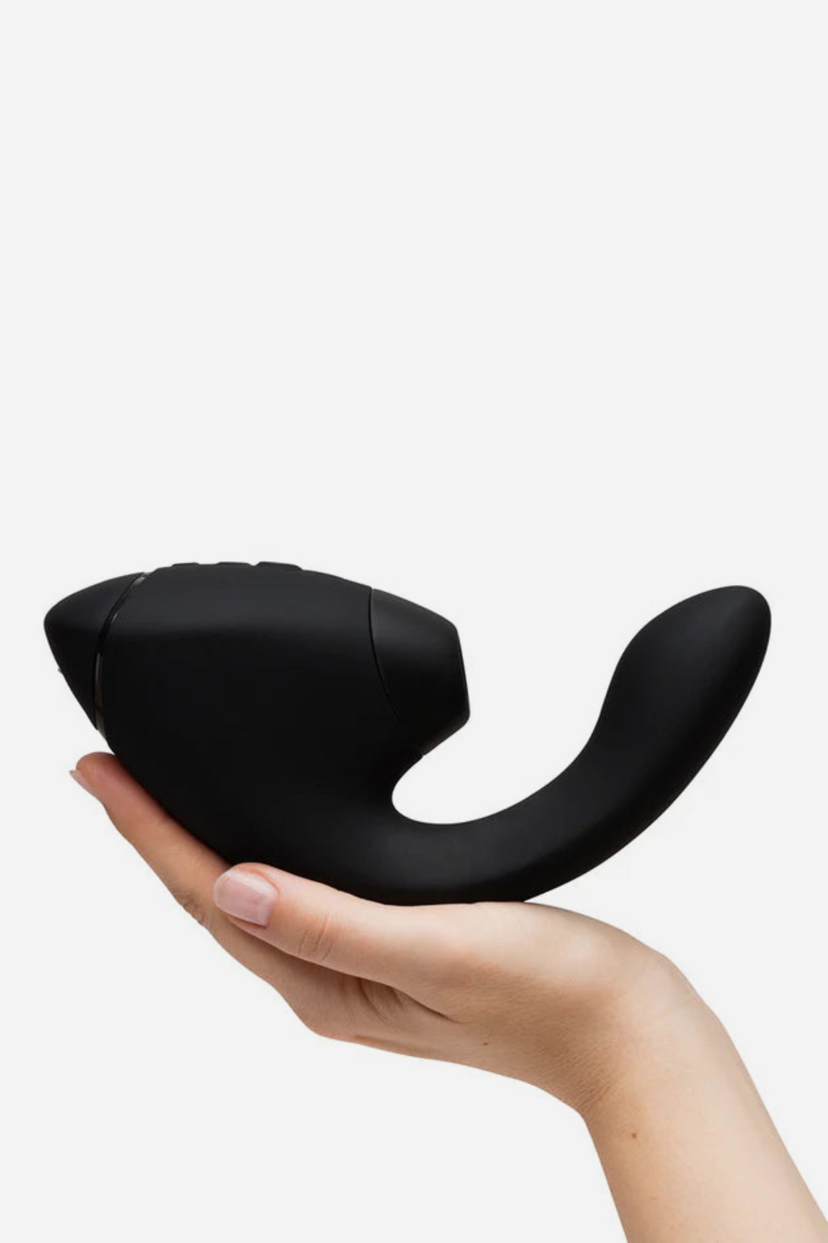 Hand holding the black Womanizer Next Duo Air Pulse Rabbit Vibe to show its size, with the suction head and flexible internal arm