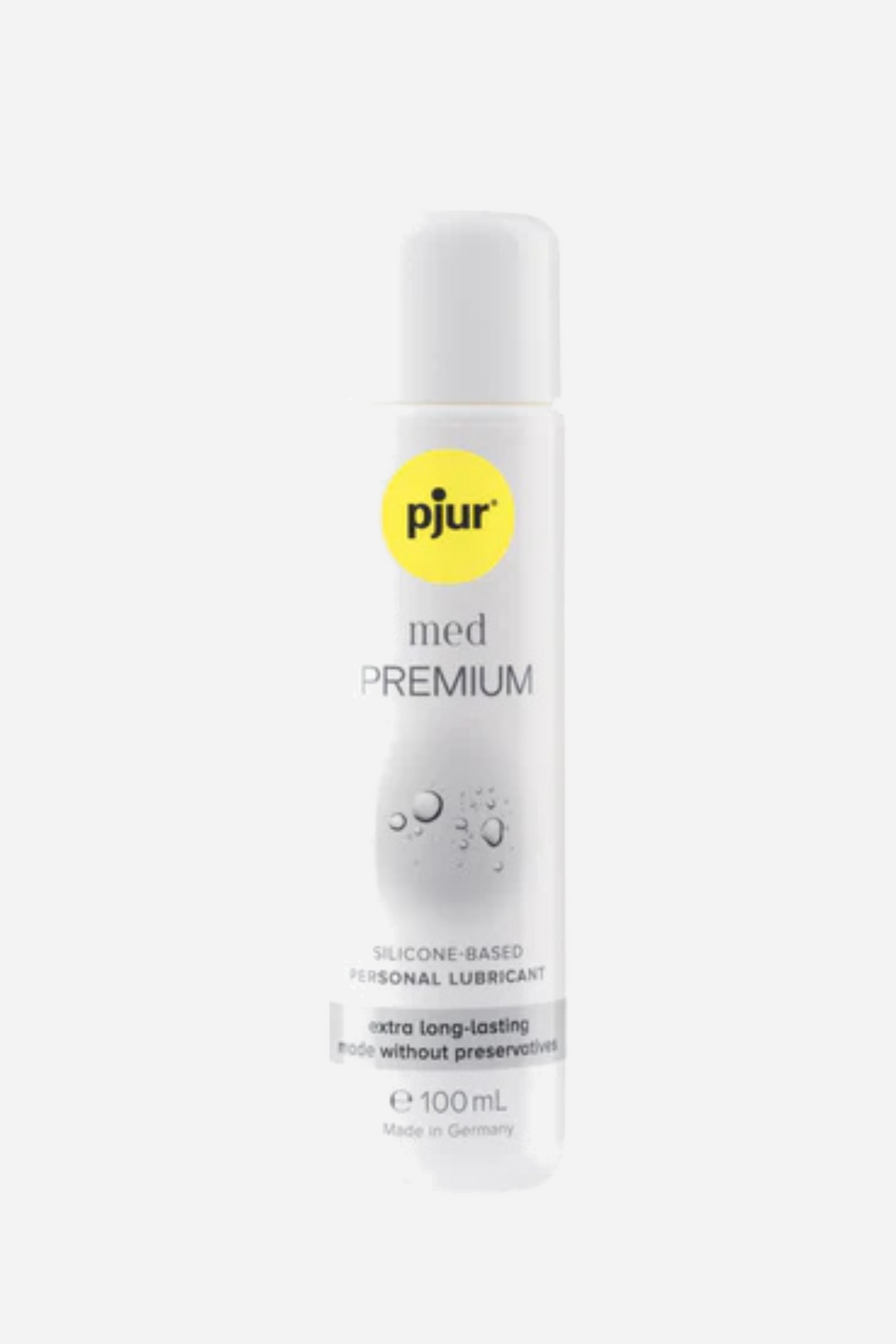 The current pjur med Premium Glide bottle, a slim white pump bottle with the yellow pjur logo and grey product text, on a plain grey backdrop.