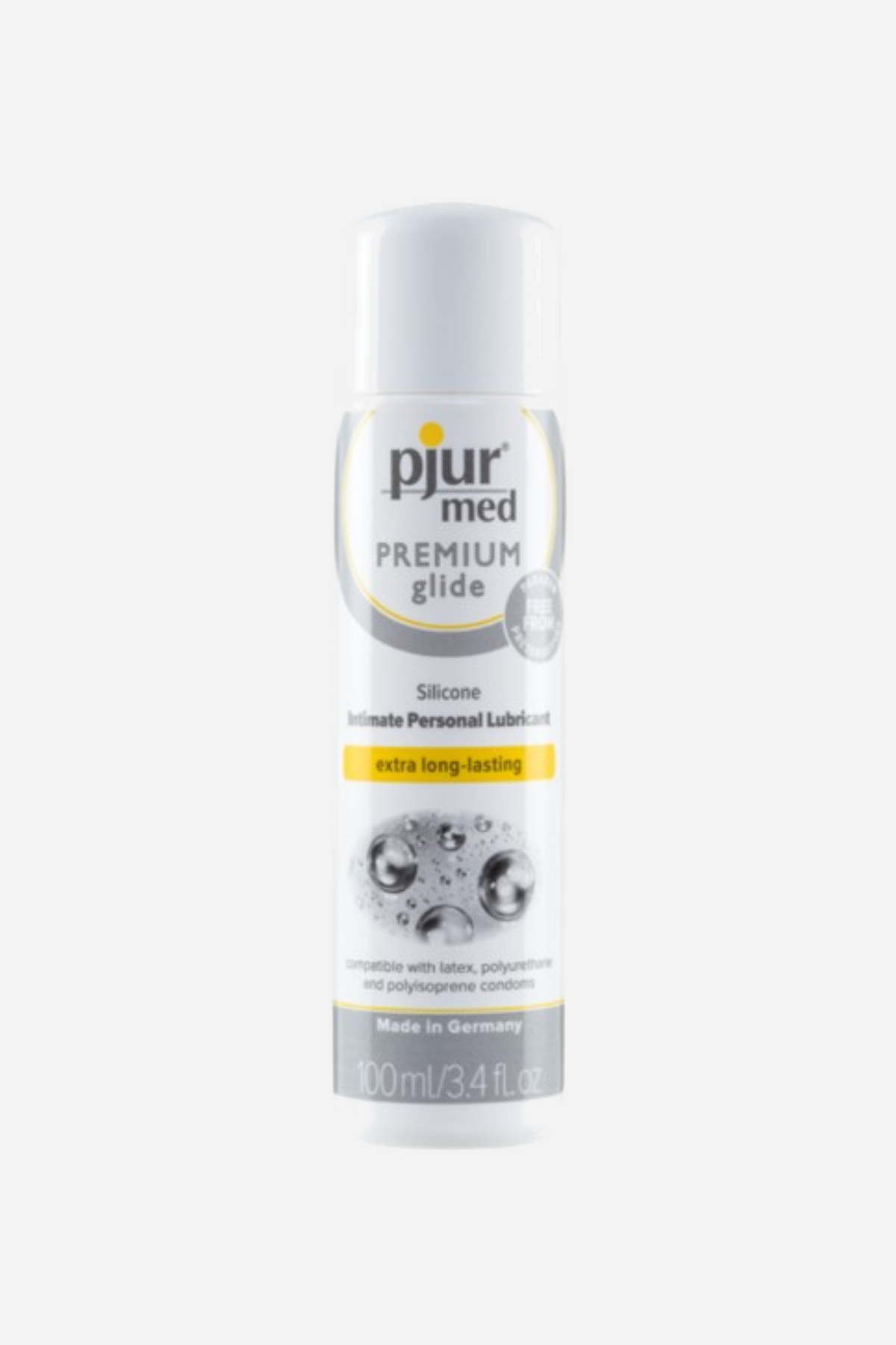 The older pjur med Premium Glide packaging, a silver and white bottle with a yellow band and a photograph of water droplets on the label.