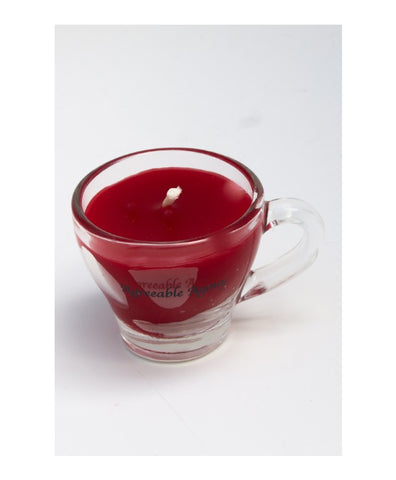 mini espresso glass cup with dark red candle inside for kinky wax play. sticker says agreeable agony