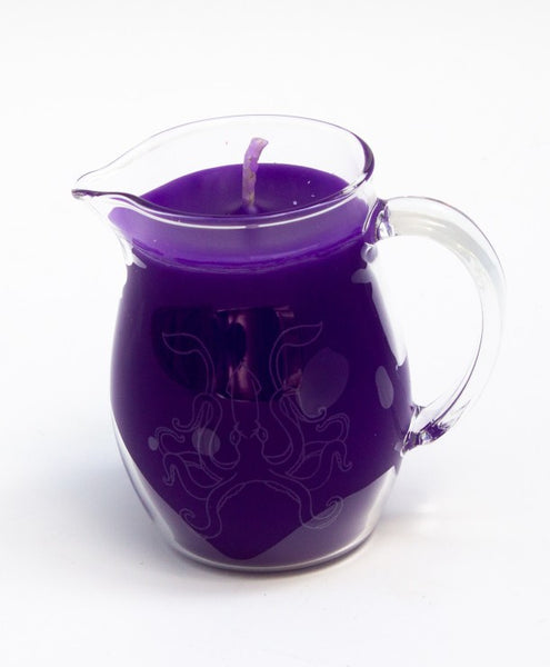 glass pitcher with pour spout filled with purple paraffin wax for kinky wax play