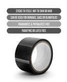 roll of black bondage tape with specs above that read: sticks to self not skin; can be used for bondage, gags, or blindfolds, fragrance free, paraffin and latex free
