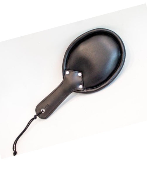 Good Girl Bad Girl Cushioned Leather Paddle has a rounded paddle with padding under the soft black leather
